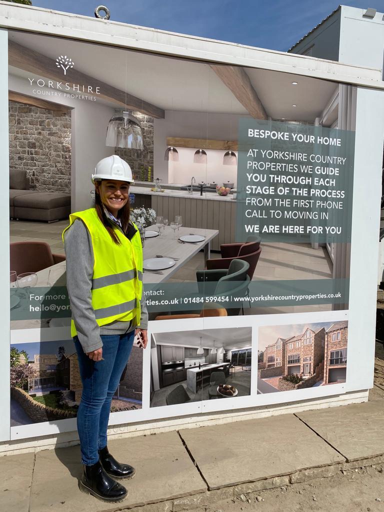 Samantha our Sales Manager outside the Marketing Suite at our Netherthong site